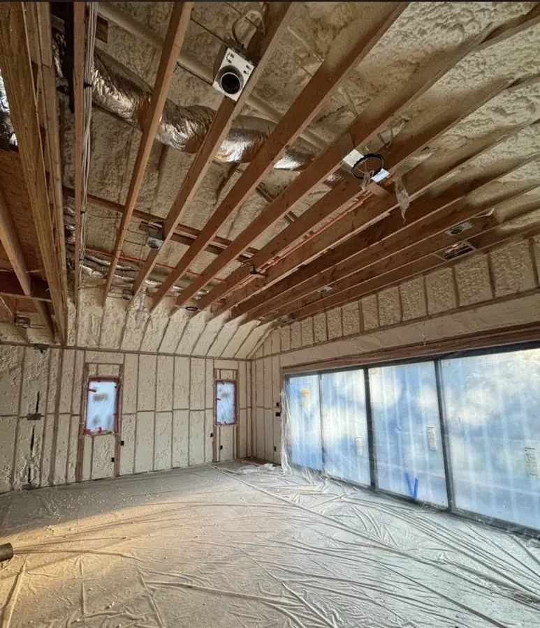Interior walls and ceiling insulated with spray foam during new construction in Rye